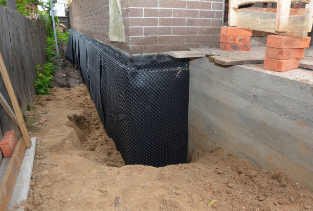 Happy homeowners after waterproofing job in Greenville